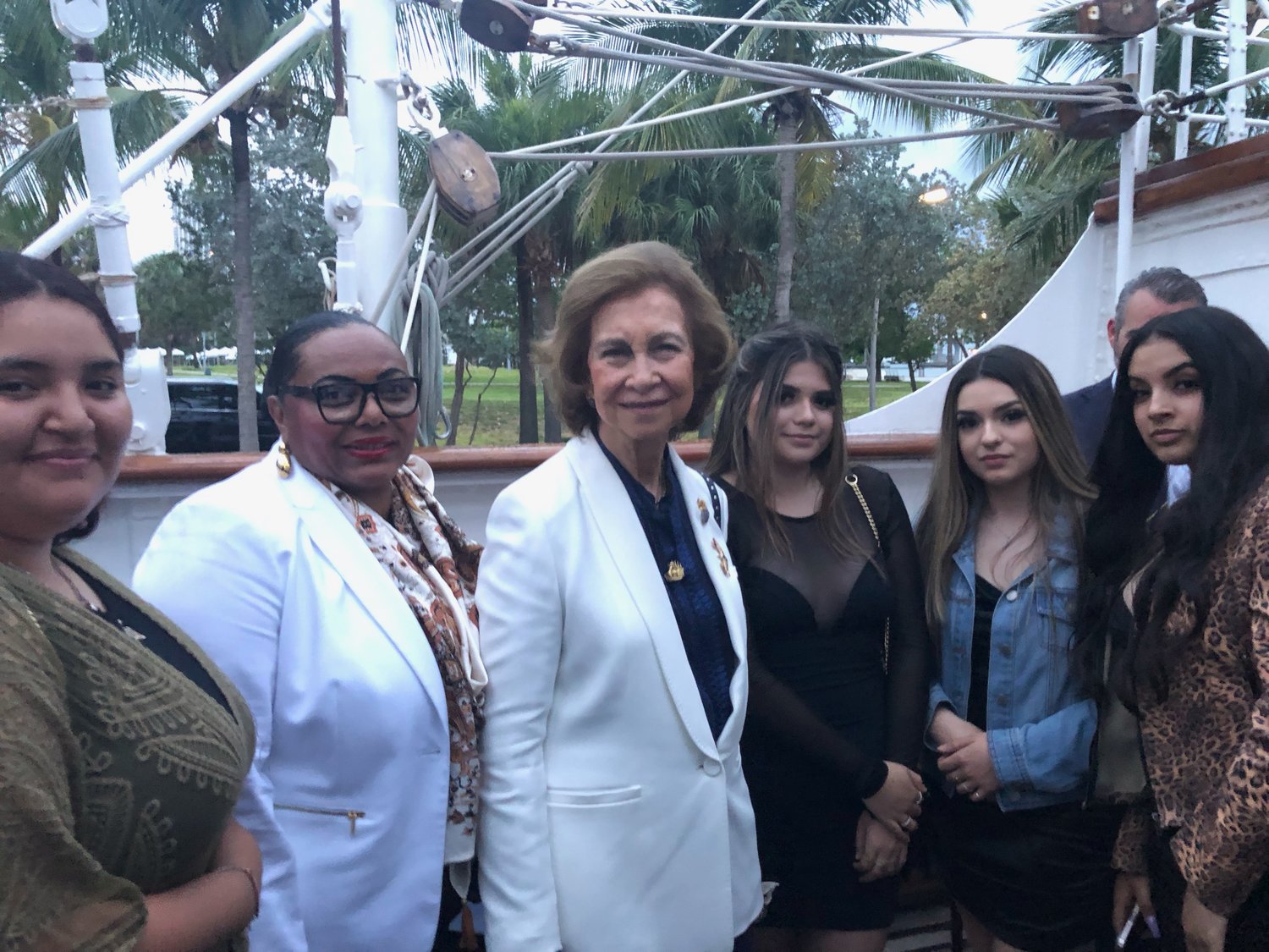 Principal Linda Johnson-Earsley and high school students from Everglades Preparatory Academy in Pahokee meet with Queen Sofia of Spain (center) in Miami.